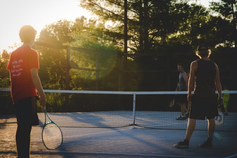 A group of people playing tennis