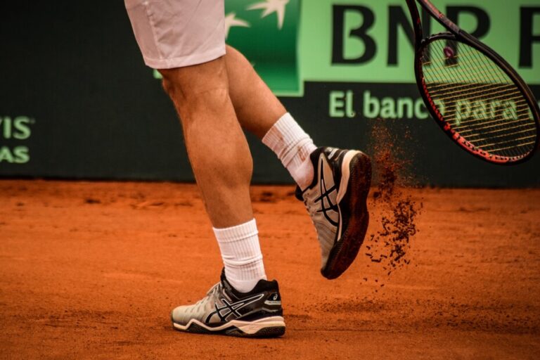A man wearing tennis shoes