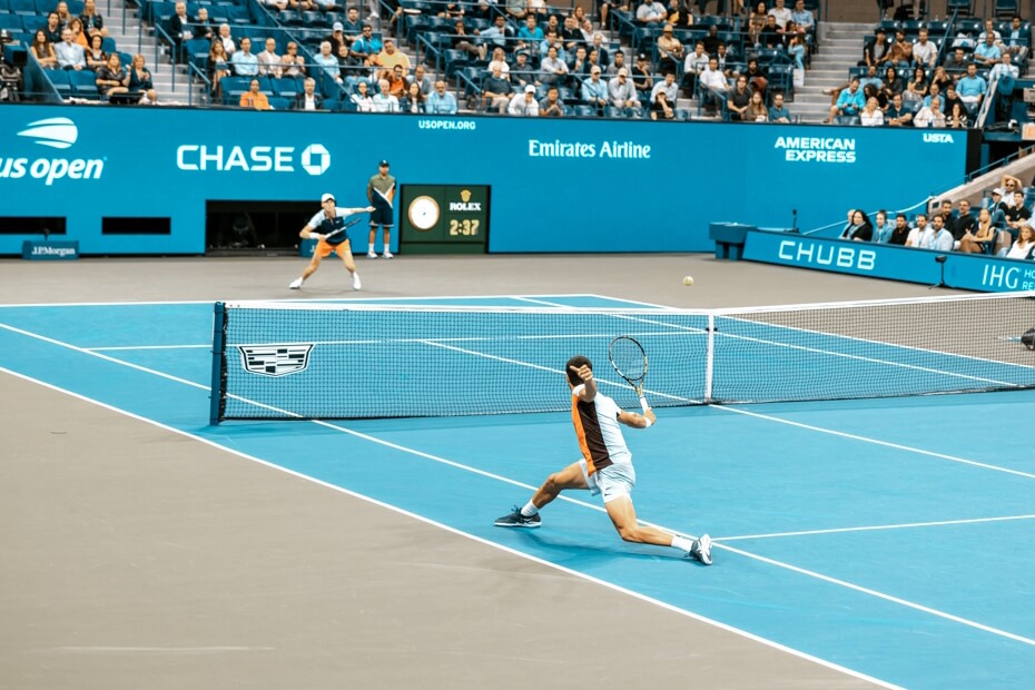 A tennis rally between two players